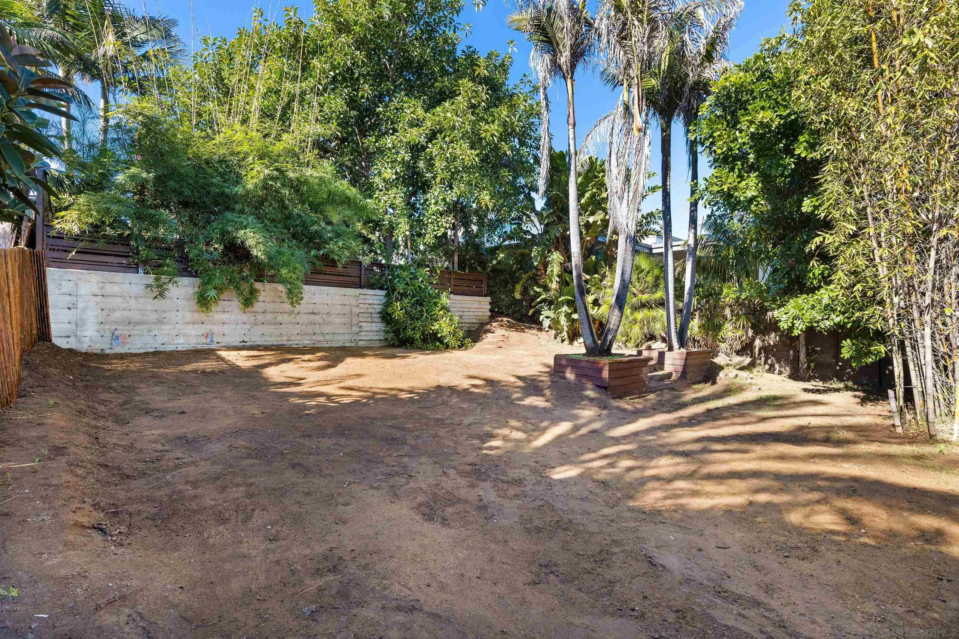 843 Neptune Avenue Encinitas, CA 92024 - Photo 39 of 49 a view of a backyard with large trees