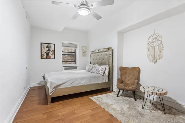 a bedroom with a bed and a chair