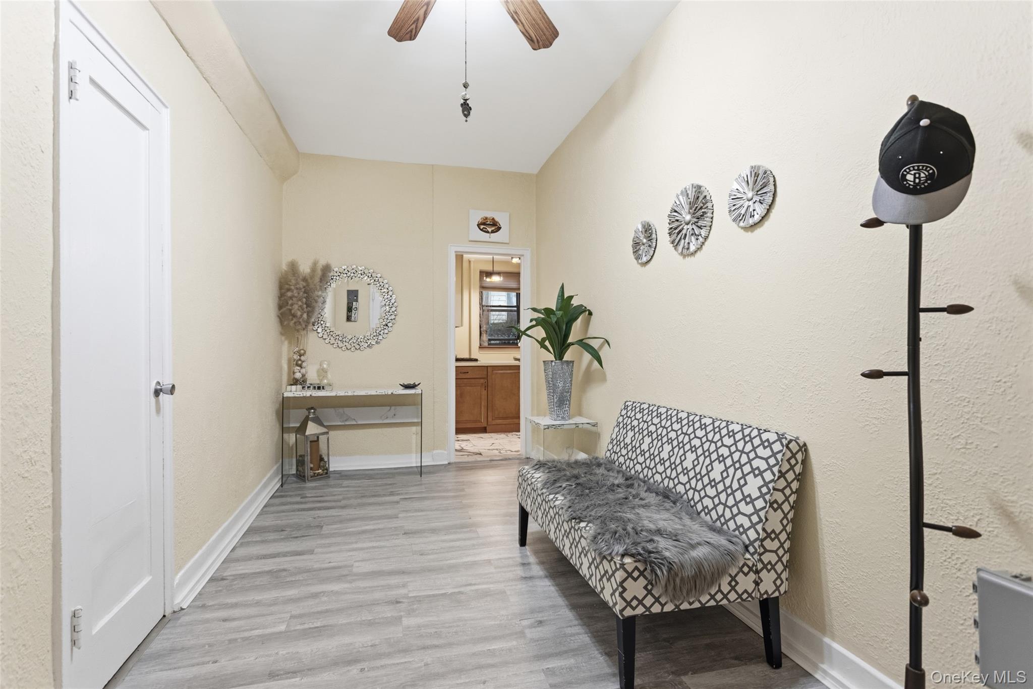 30 Clinton Place, Unit LB New Rochelle, NY 10801 - Photo 2 of 17 a living room with furniture and a wooden floor