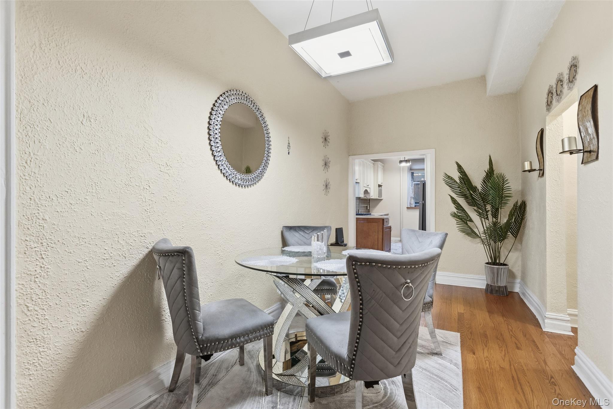 30 Clinton Place, Unit LB New Rochelle, NY 10801 - Photo 5 of 17 a view of a dining room with furniture and wooden floor