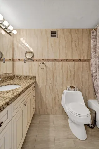 a bed room with a bed and a television