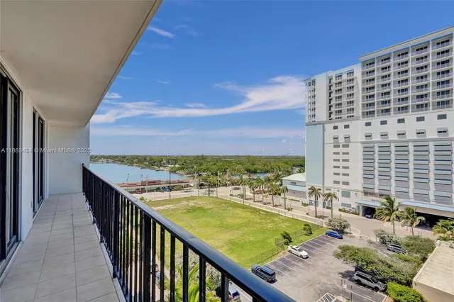 a view of a swimming pool with an outdoor seating