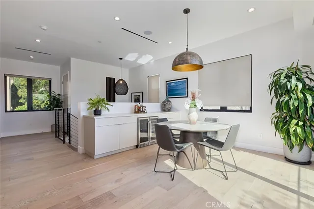 a kitchen with a table and chairs in it