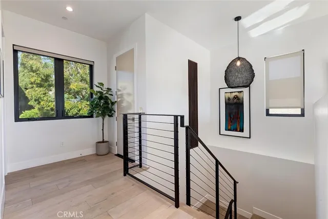 a view of a hallway with windows
