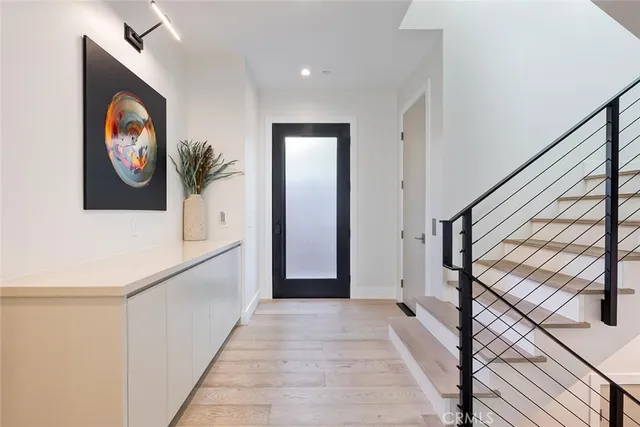 a view of a hallway with paintings on the wall