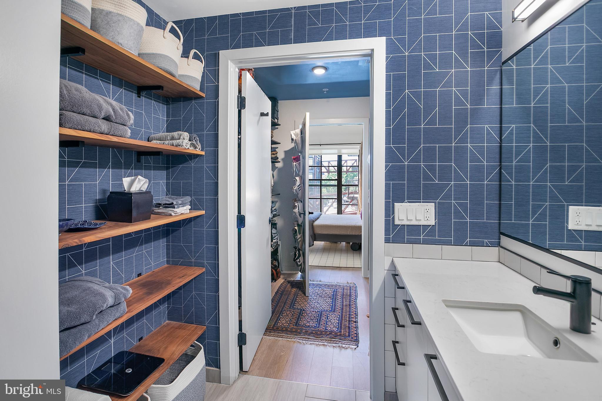 1625 Eckington Place Northeast, Unit 421 Washington, DC 20002 - Photo 14 of 40 a bathroom with a sink and a shower