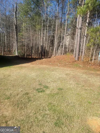 a view of outdoor space with wooden fence