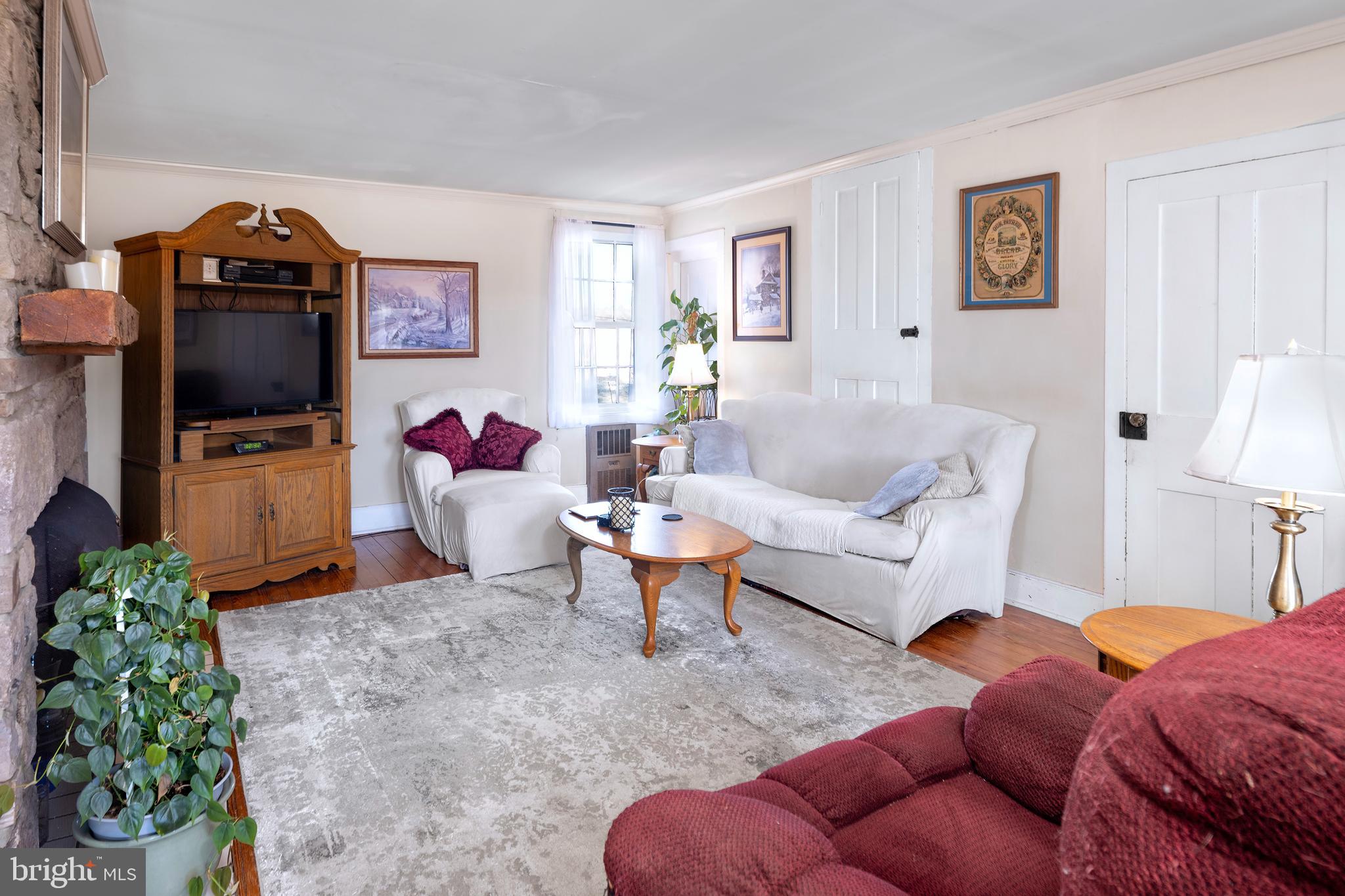 960 Sergeantsville Road Stockton, NJ 08559 - Photo 4 of 26 a living room with furniture a flat screen tv and a lamp