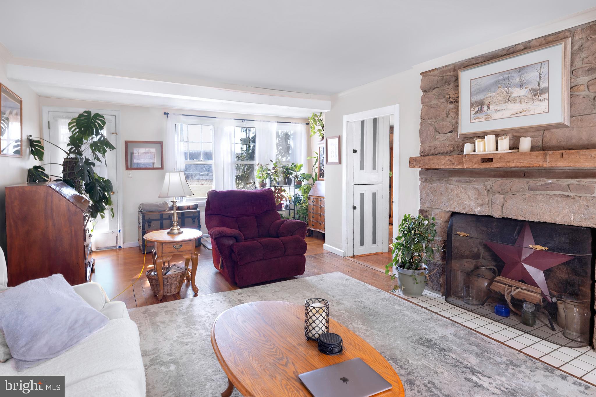 960 Sergeantsville Road Stockton, NJ 08559 - Photo 5 of 26 a living room with furniture and a fireplace