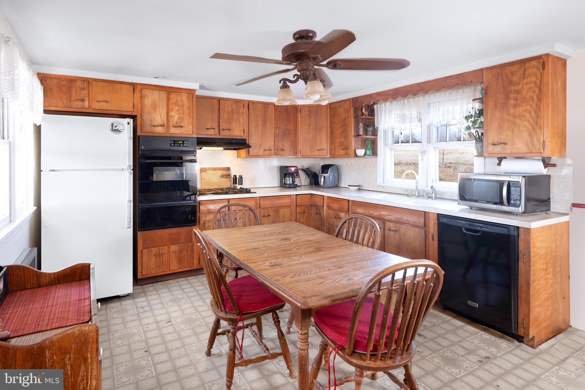 960 Sergeantsville Road Stockton, NJ 08559 - Photo 6 of 26 a kitchen with stainless steel appliances granite countertop a kitchen island a table and chairs in it