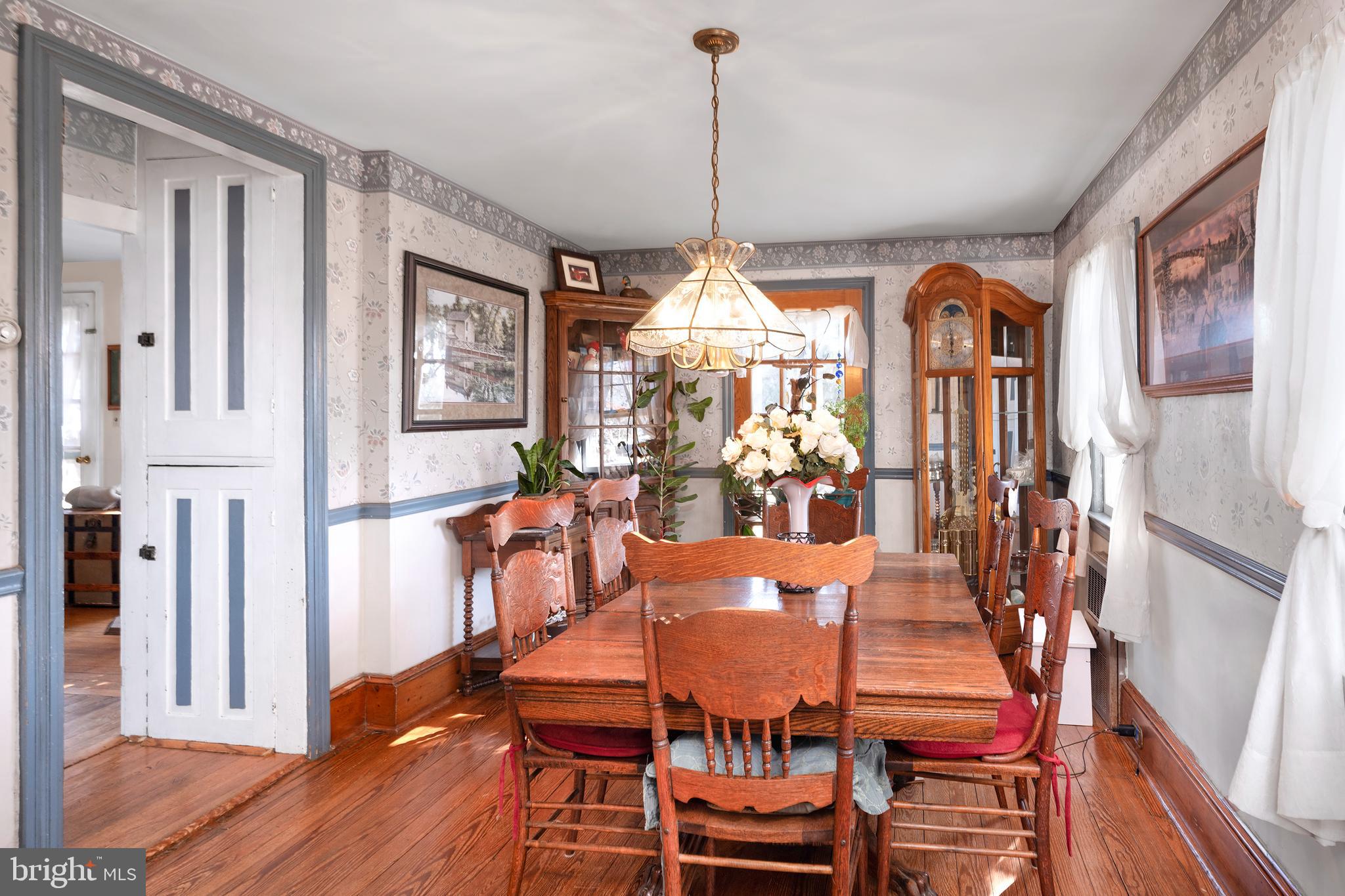 960 Sergeantsville Road Stockton, NJ 08559 - Photo 7 of 26 a view of a dining room with furniture window and wooden floor