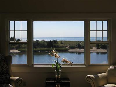 Undisclosed Address Centerville, MA 02632 - Photo 3 of 13 a view of a lake from a living room