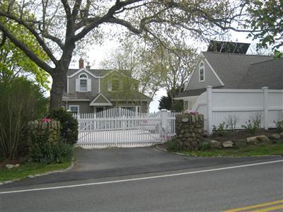 Undisclosed Address Centerville, MA 02632 - Photo 7 of 13 a front view of a house with a garden