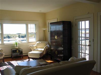 Undisclosed Address Centerville, MA 02632 - Photo 10 of 13 a living room with furniture and a window