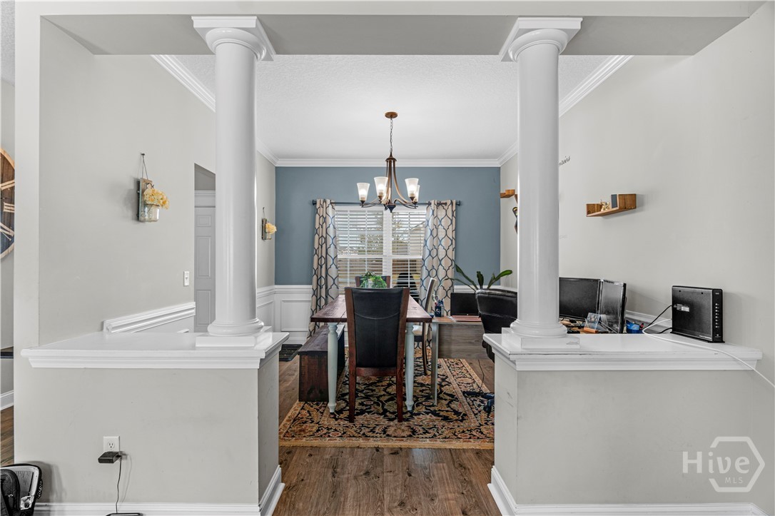 223 Rutledge Drive Hinesville, GA 31313 - Photo 6 of 35 Beautiful columns & crown molding surround dining room.