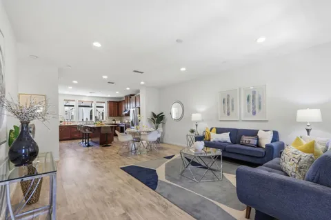 a living room with furniture and a table