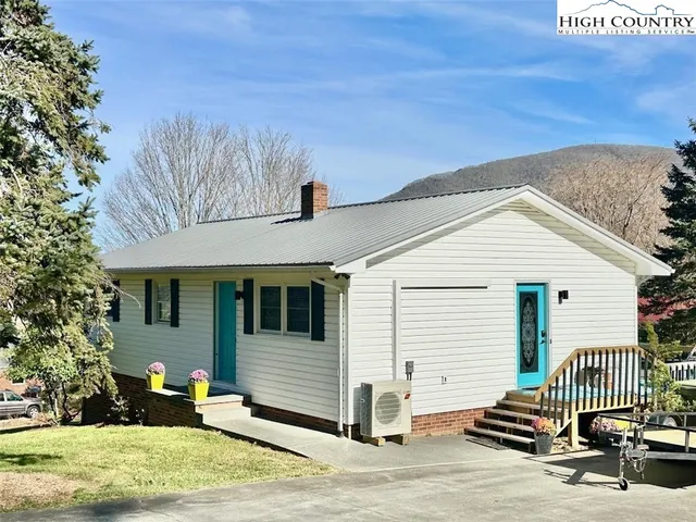 a front view of a house with a garage
