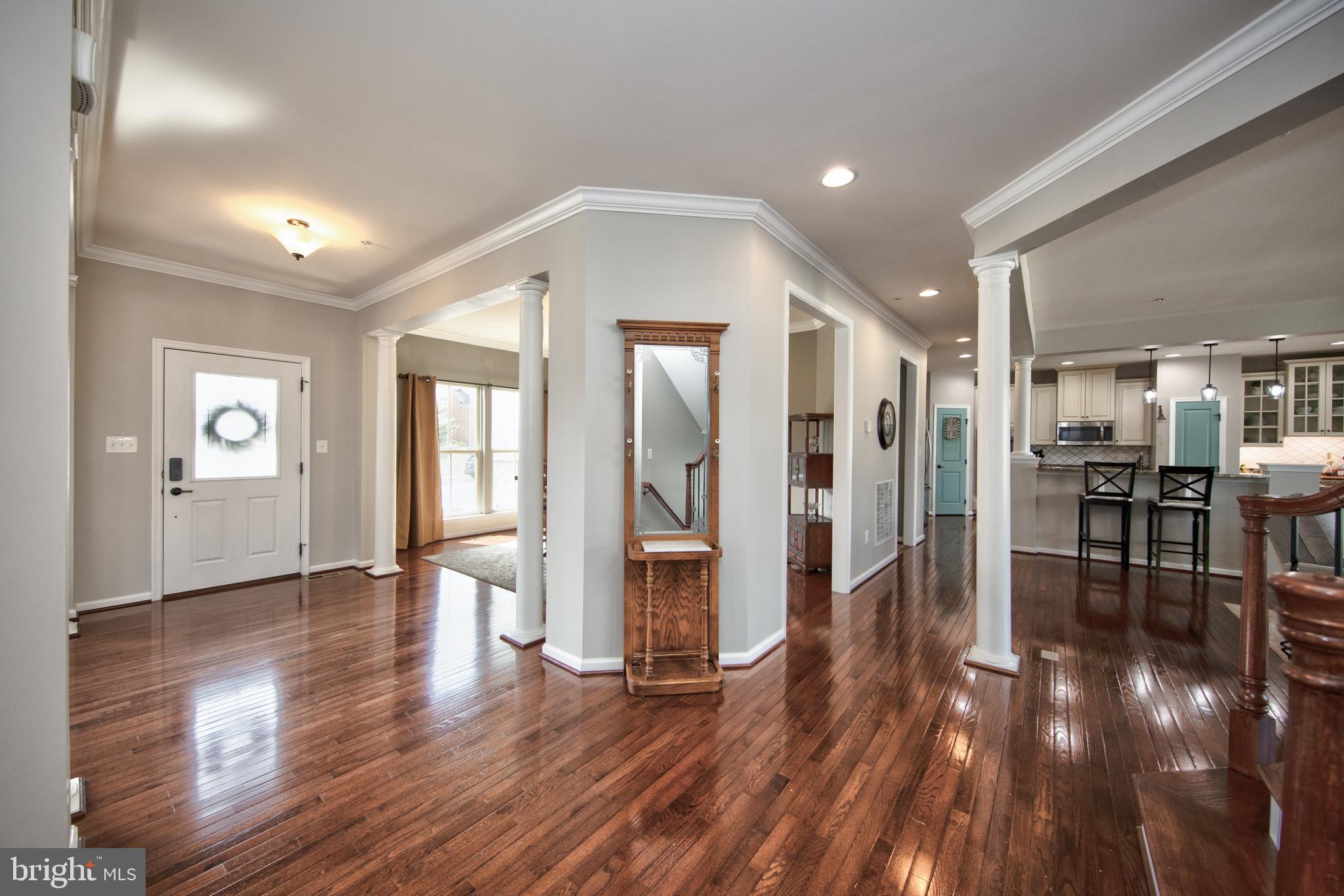 10415 Windlass Run Road Baltimore, MD 21220 - Photo 8 of 52 a view of a big room with wooden floor and windows