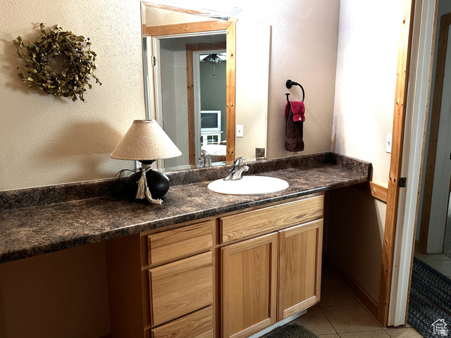 1940 East Shore Road St. Charles, ID 83272 - Photo 43 of 64 Bathroom with a textured wall, vanity, and light tile patterned floors
