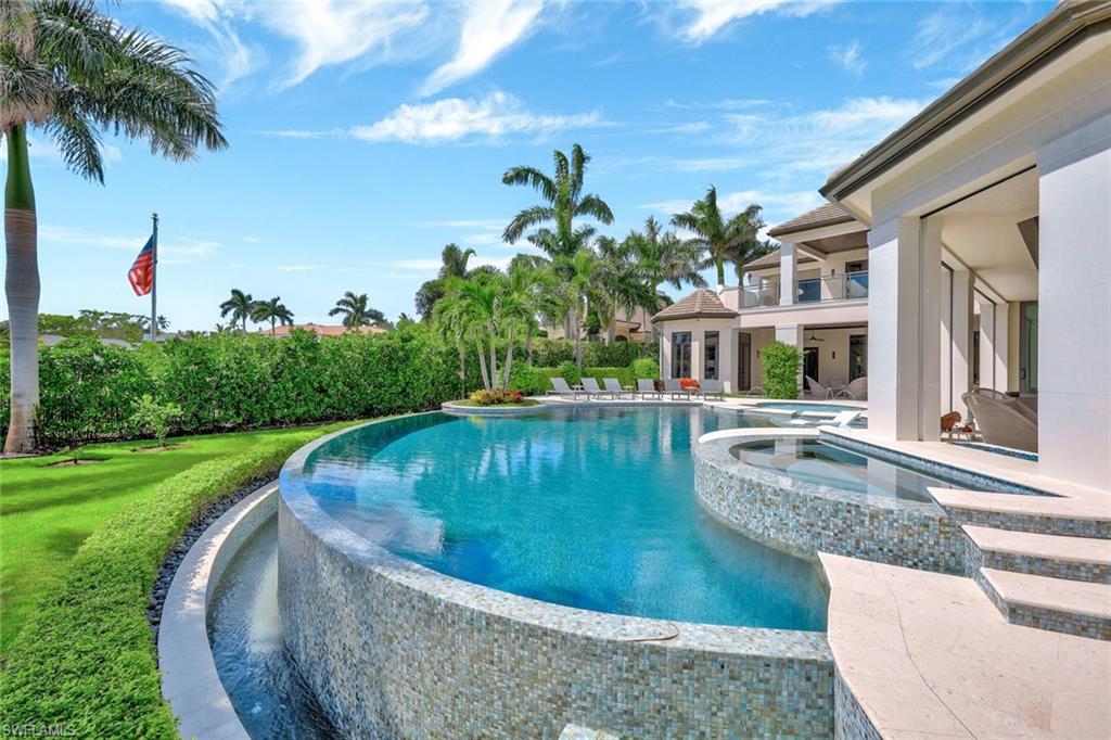 850 Nelson`s Walk Naples, FL 34102 - Photo 14 of 47 a view of a house with swimming pool and a yard