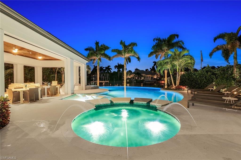 850 Nelson`s Walk Naples, FL 34102 - Photo 15 of 47 a view of a swimming pool with a patio
