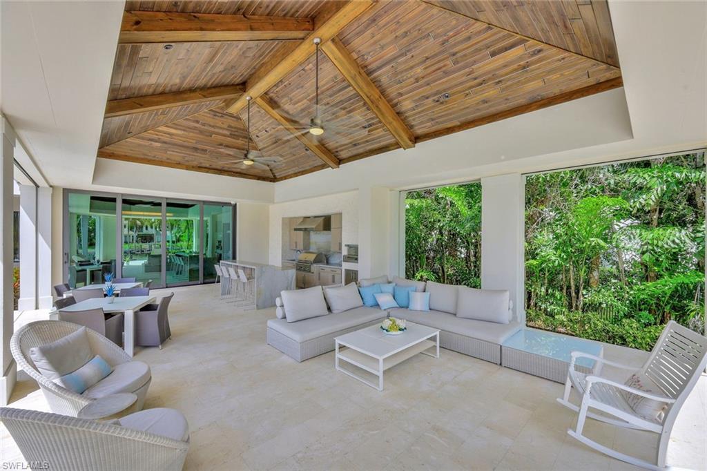 850 Nelson`s Walk Naples, FL 34102 - Photo 20 of 47 a living room with furniture and a large window