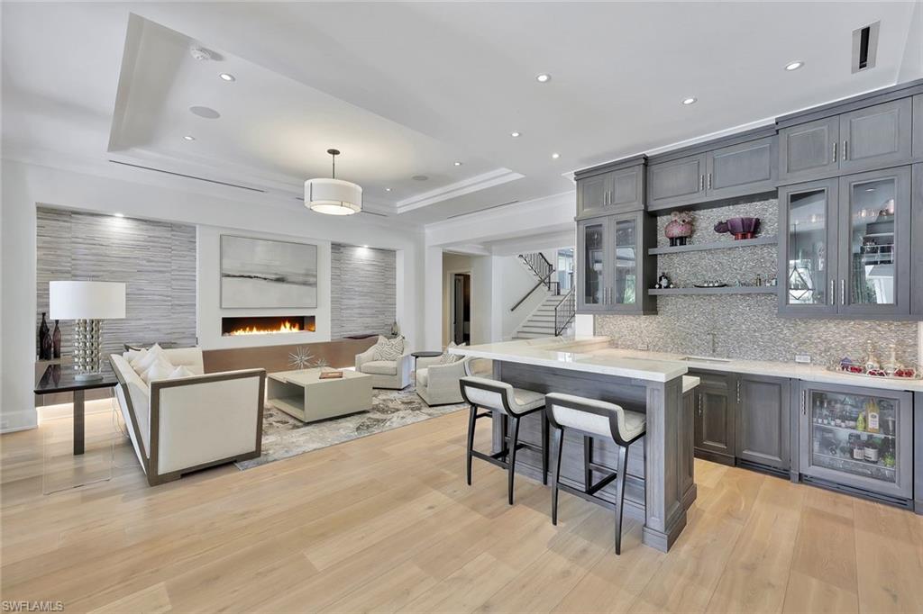 850 Nelson`s Walk Naples, FL 34102 - Photo 22 of 47 a large white kitchen with a table and chairs in it