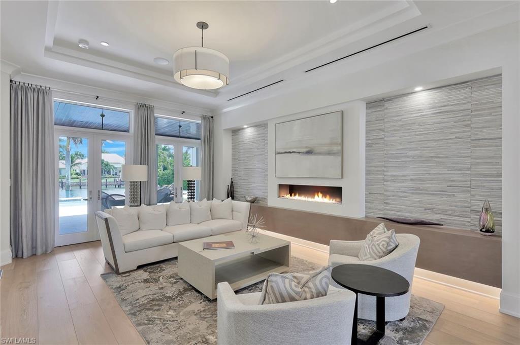 850 Nelson`s Walk Naples, FL 34102 - Photo 23 of 47 a living room with furniture and a large window