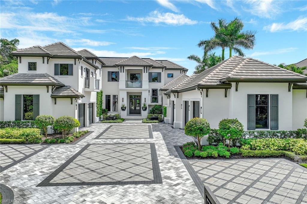 850 Nelson`s Walk Naples, FL 34102 - Photo 3 of 47 a front view of a house with garden