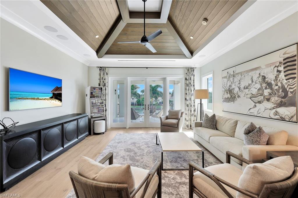 850 Nelson`s Walk Naples, FL 34102 - Photo 32 of 47 a living room with furniture and a large window