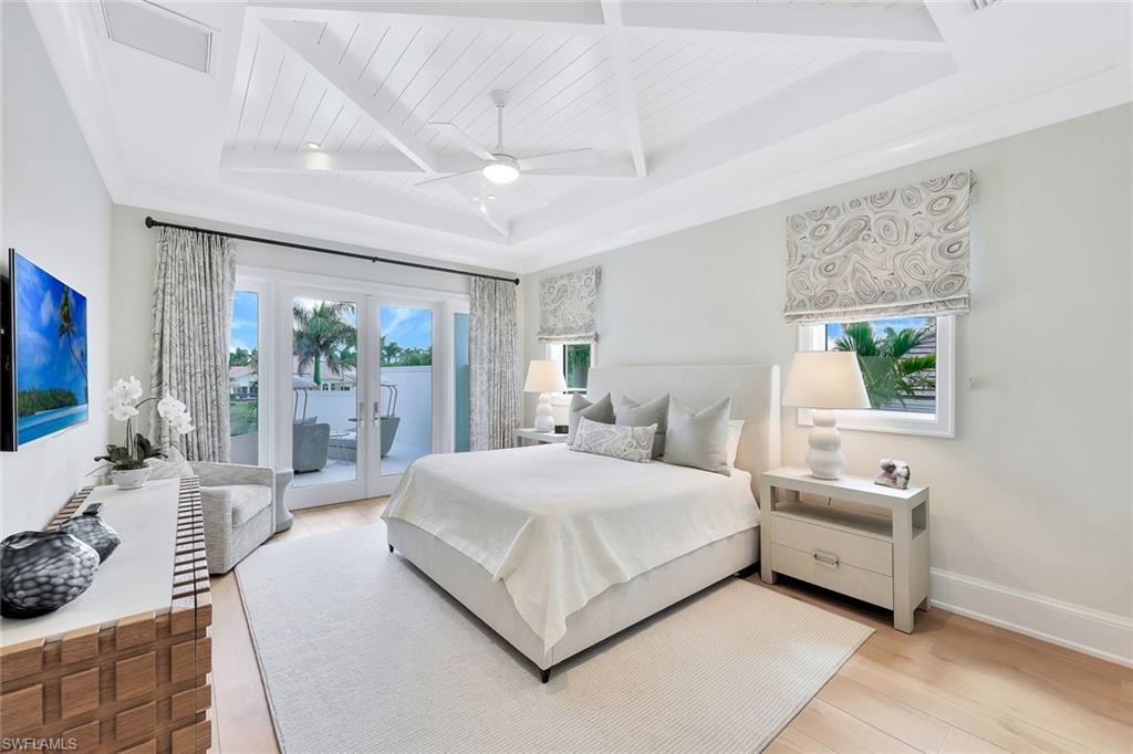 850 Nelson`s Walk Naples, FL 34102 - Photo 36 of 47 a bedroom with a large bed and a large window