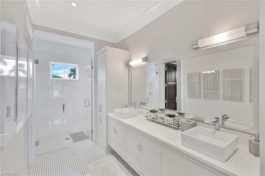 850 Nelson`s Walk Naples, FL 34102 - Photo 37 of 47 a bathroom with double sink and a mirror