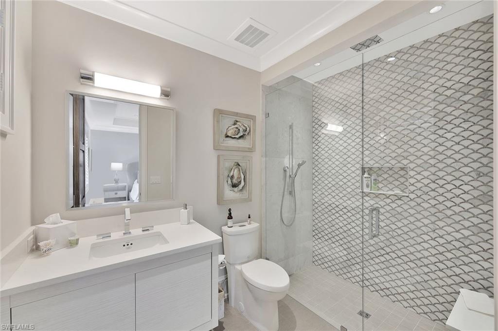 850 Nelson`s Walk Naples, FL 34102 - Photo 41 of 47 a bathroom with a sink toilet and shower
