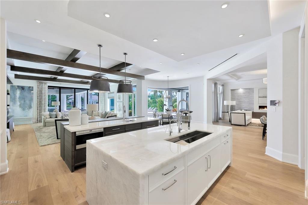 850 Nelson`s Walk Naples, FL 34102 - Photo 8 of 47 a large white kitchen with a large counter top appliances and cabinets