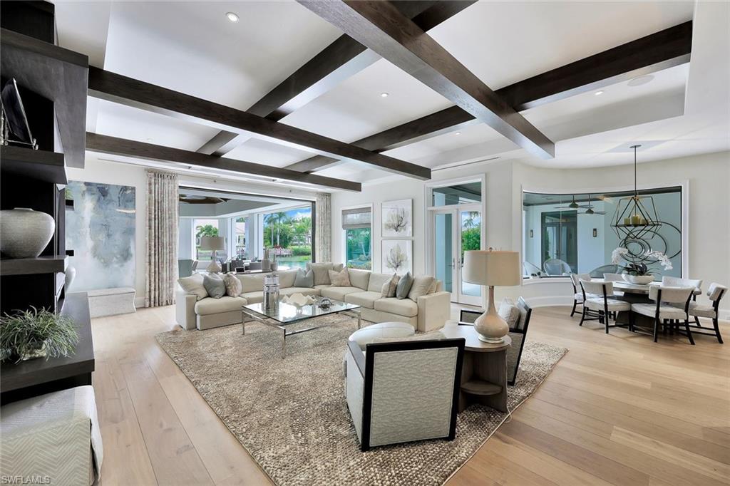850 Nelson`s Walk Naples, FL 34102 - Photo 10 of 47 a living room with fireplace furniture and a large window