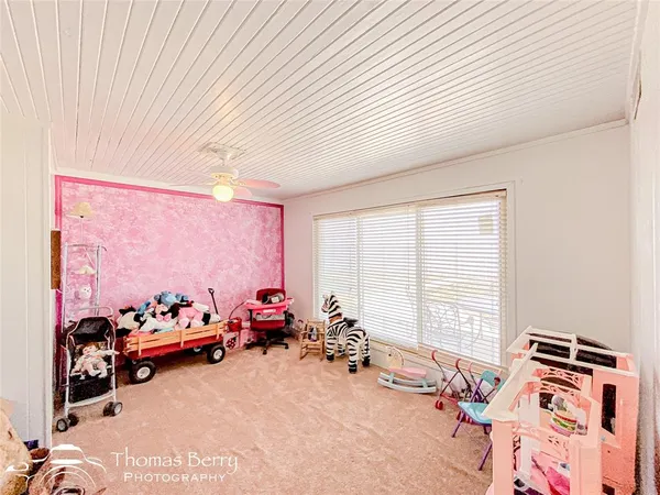 a room with furniture toys and a window