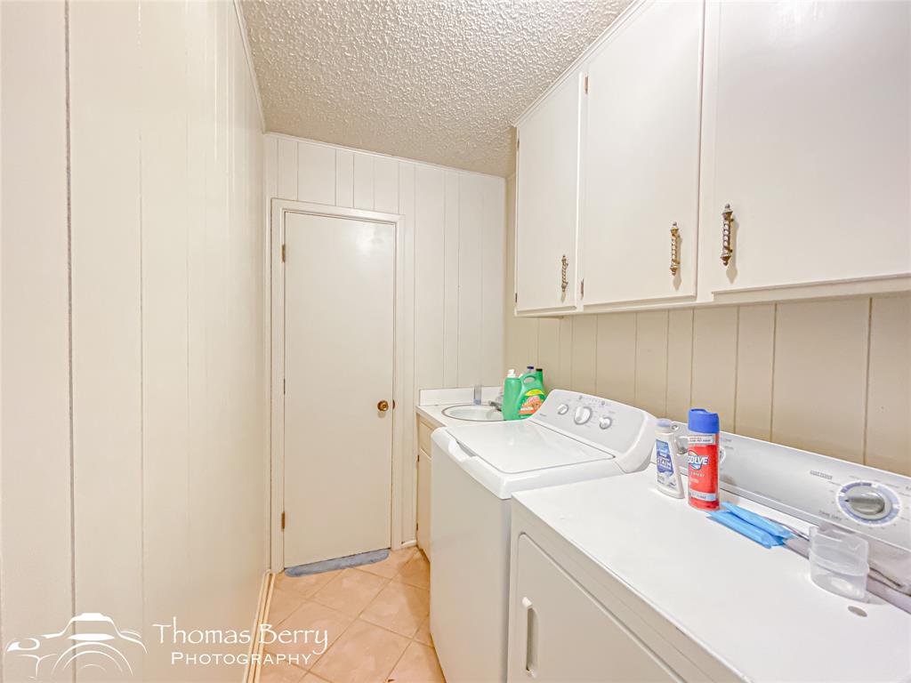 2732 County Road 248 Snyder, TX 79549 - Photo 23 of 31 a utility room with dryer and washer
