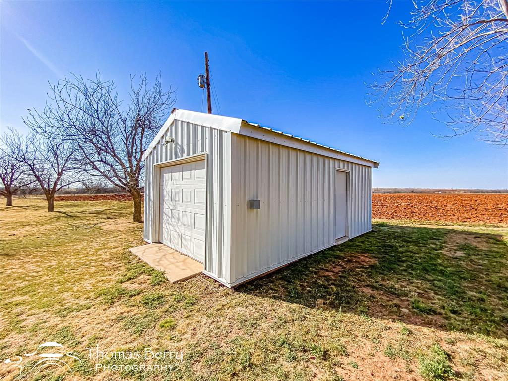 2732 County Road 248 Snyder, TX 79549 - Photo 25 of 31 a front view of a house with a yard