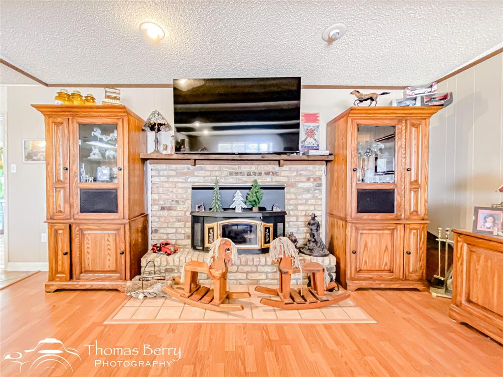 2732 County Road 248 Snyder, TX 79549 - Photo 4 of 31 a living room with furniture and a flat screen tv
