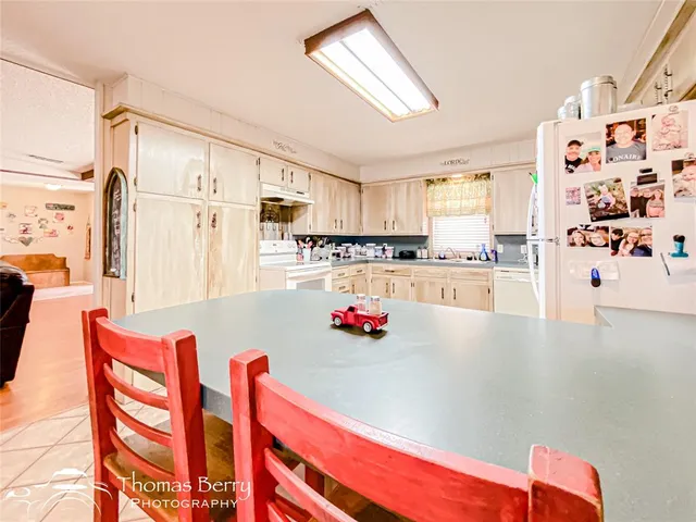 a kitchen with stainless steel appliances cabinets and a refrigerator