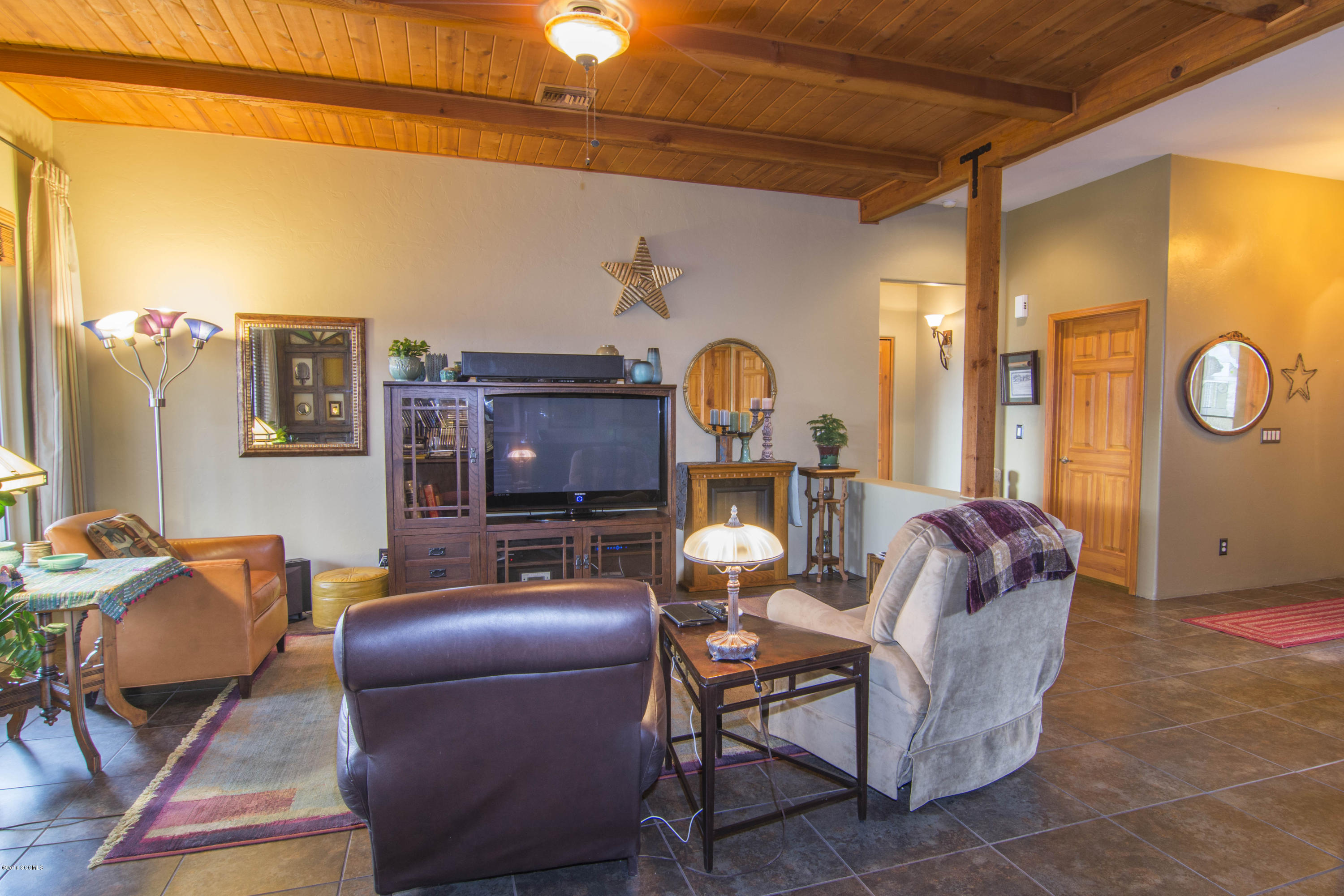 66 Camino Nacozari Rio Rico, AZ 85648 - Photo 40 of 55 a living room with furniture a rug and a fireplace