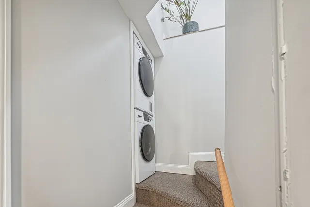 a bathroom with a toilet and a mirror
