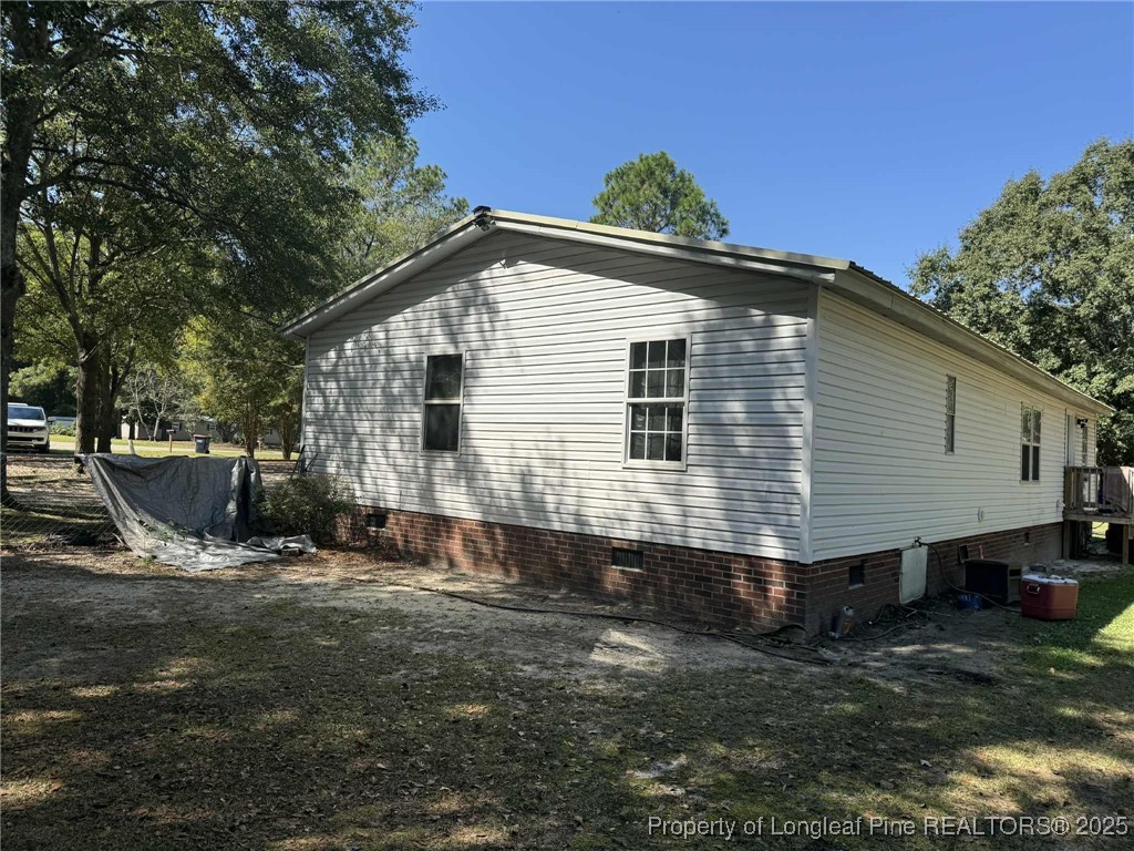 212 Grummen Road Hope Mills, NC 28348 - Photo 11 of 14 a front view of a house with a yard
