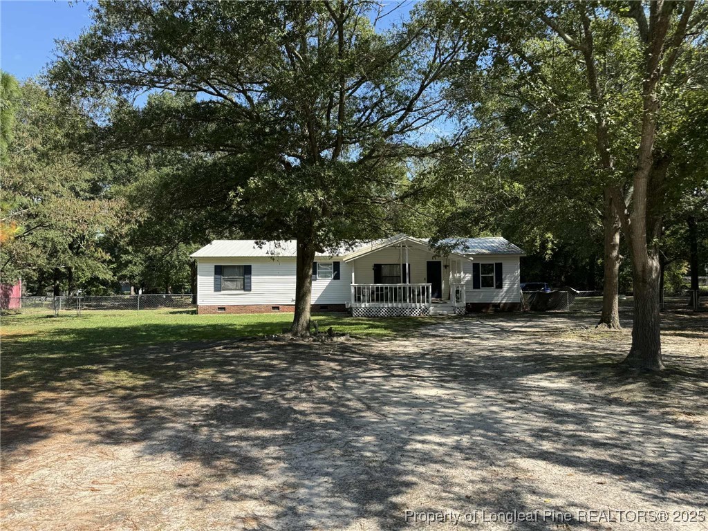 212 Grummen Road Hope Mills, NC 28348 - Photo 2 of 14 a front view of a house with garden