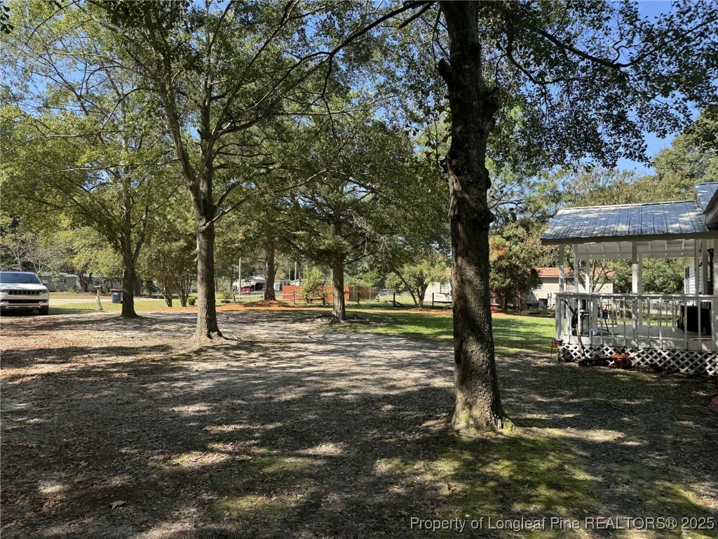 212 Grummen Road Hope Mills, NC 28348 - Photo 3 of 14 a view of a street with a tree