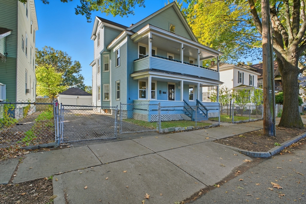 a view of a house with a yard