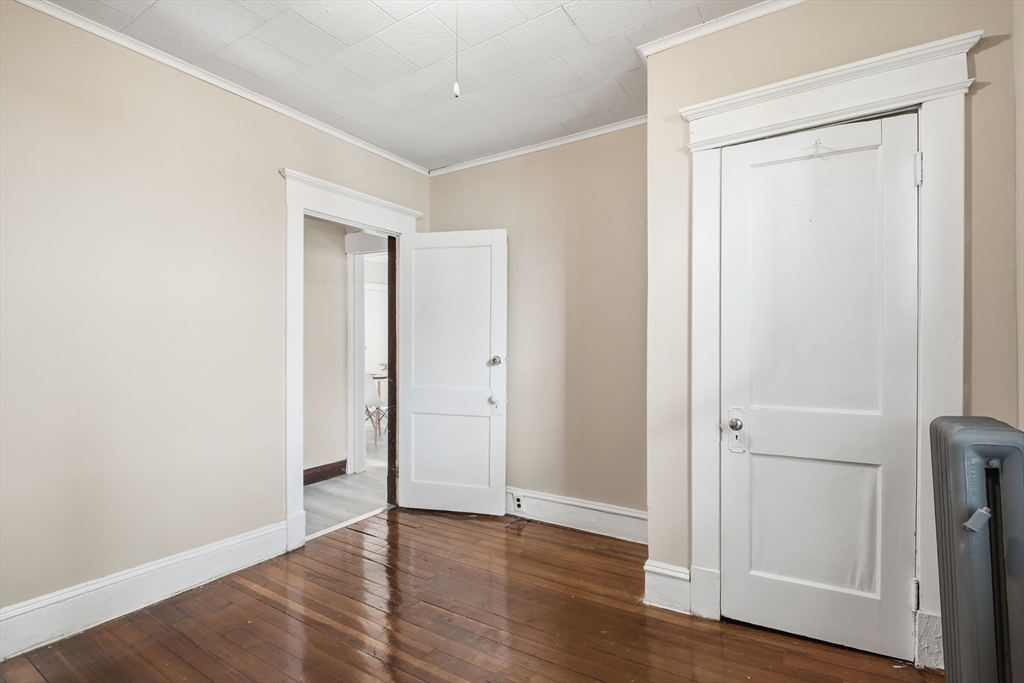 51-53 Abbe Avenue Springfield, MA 01107 - Photo 17 of 42 an empty room with wooden floor & closet area