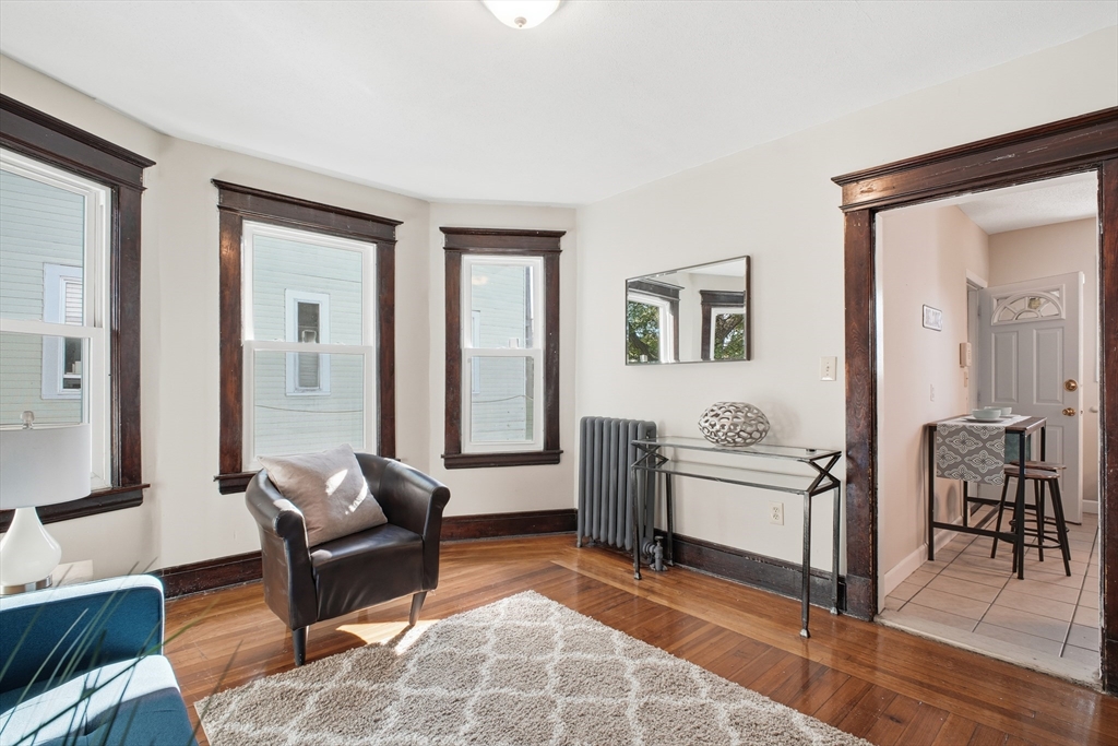 51-53 Abbe Avenue Springfield, MA 01107 - Photo 23 of 42 a living room with furniture and wooden floor