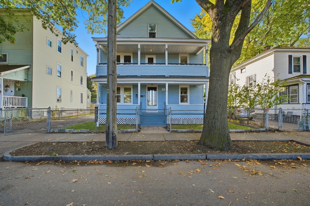 51-53 Abbe Avenue Springfield, MA 01107 - Photo 3 of 42 a front view of a house with a yard