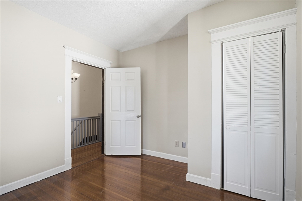 51-53 Abbe Avenue Springfield, MA 01107 - Photo 31 of 42 an empty room with wooden floor and closet